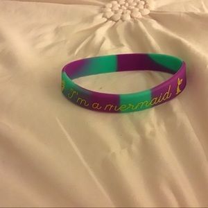 It is til and purple with gold writing on it